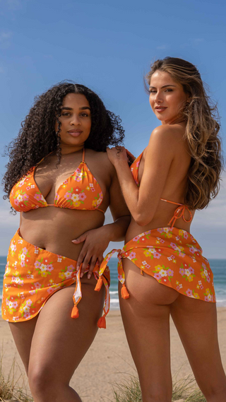 Peony print cotton sarong with adjustable tie fastening.