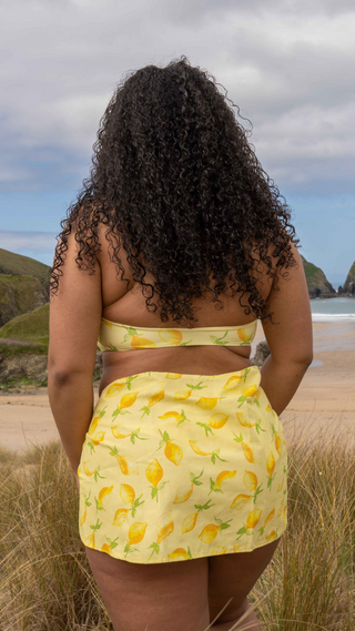 Limoncello mini tie sarong in a lemon printed fabric.