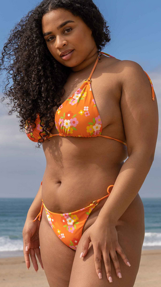 Peony print bikini set with gold ring detail and adjustable tie sides.