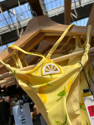Handmade lemon print bikini bottom with minimal coverage.